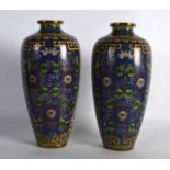 A PAIR OF EARLY 20TH CENTURY CHINESE CLOISONNE ENAMEL VASES decorated with floral sprays. 8.25ins