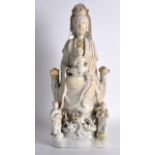 AN 18TH/19TH CENTURY CHINESE BLANC DE CHINE FIGURE OF GUANYIN modelled with three attendants upon