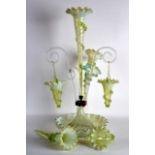 A LATE VICTORIAN GREEN GLASS EPERGNE. 1Ft 11ins high.