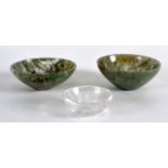 A PAIR OF SMALL CHINESE MOSS AGATE BOWLS together with another smaller crystal bowl. (3)
