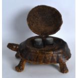 AN UNUSUAL EDWARDIAN CARVED TORTOISESHELL INKWELL of naturalistic form, with rising shell. 6.75ins