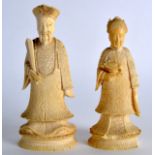 A PAIR OF 19TH CENTURY CHINESE CANTON CARVED IVORY CHESS PIECES engraved with flowers. 4.25ins &