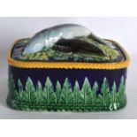 A GOOD 19TH CENTURY MAJOLICA GEORGE JONES SARDINE DISH AND COVER overlaid with fish and foliage. 5.