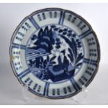 AN 18TH CENTURY JAPANESE EDO PERIOD BLUE AND WHITE DISH painted with a figure under calligraphy. 7.