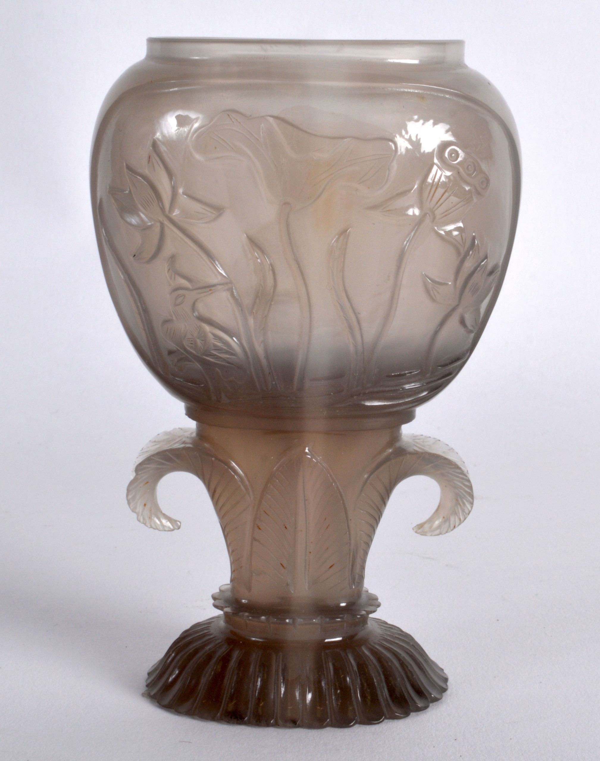 A CHINESE QING DYNASTY MUGHAL STYLE AGATE VASE decorated with animals and flowers, upon a