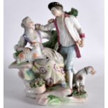 AN 18TH CENTURY ENGLISH PORCELAIN FIGURAL GROUP depicting a male and female beside a hound and sheep