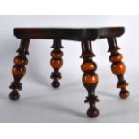 A LOVELY ANTIQUE LIGNUM VITAE MINIATURE TREEN STOOL supported upon four bobbin turned legs. 6.5ins x