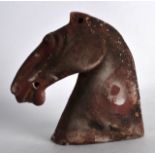 A CHINESE HAN DYNASTY POTTERY BUST OF A HORSE of iron red colour. 6.5ins high.