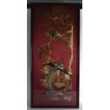 A LARGE AND RARE LATE 19TH CENTURY CHINESE RED GROUND SILK PANEL depicting a bird of paradise