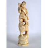 A LATE 19TH CENTURY JAPANESE MEIJI PERIOD CARVED IVORY OKIMONO modelled as a girl holding a sword