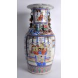 A 19TH CENTURY CHINESE CANTON FAMILLE ROSE VASE painted with figural panels, overlaid with roaming