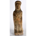 AN EARLY CARVED STONE FIGURE OF A STANDING FEMALE. 4.75ins high.