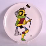 A STYLISH CANADIAN CLAIR MILLETT 'MOMO' CABINET PLATE depicting a figure holding a bow and arrow
