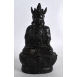 A 16TH/17TH CENTURY CHINESE BRONZE FIGURE OF A BUDDHA Ming, modelled holding a vessel upon a lotus