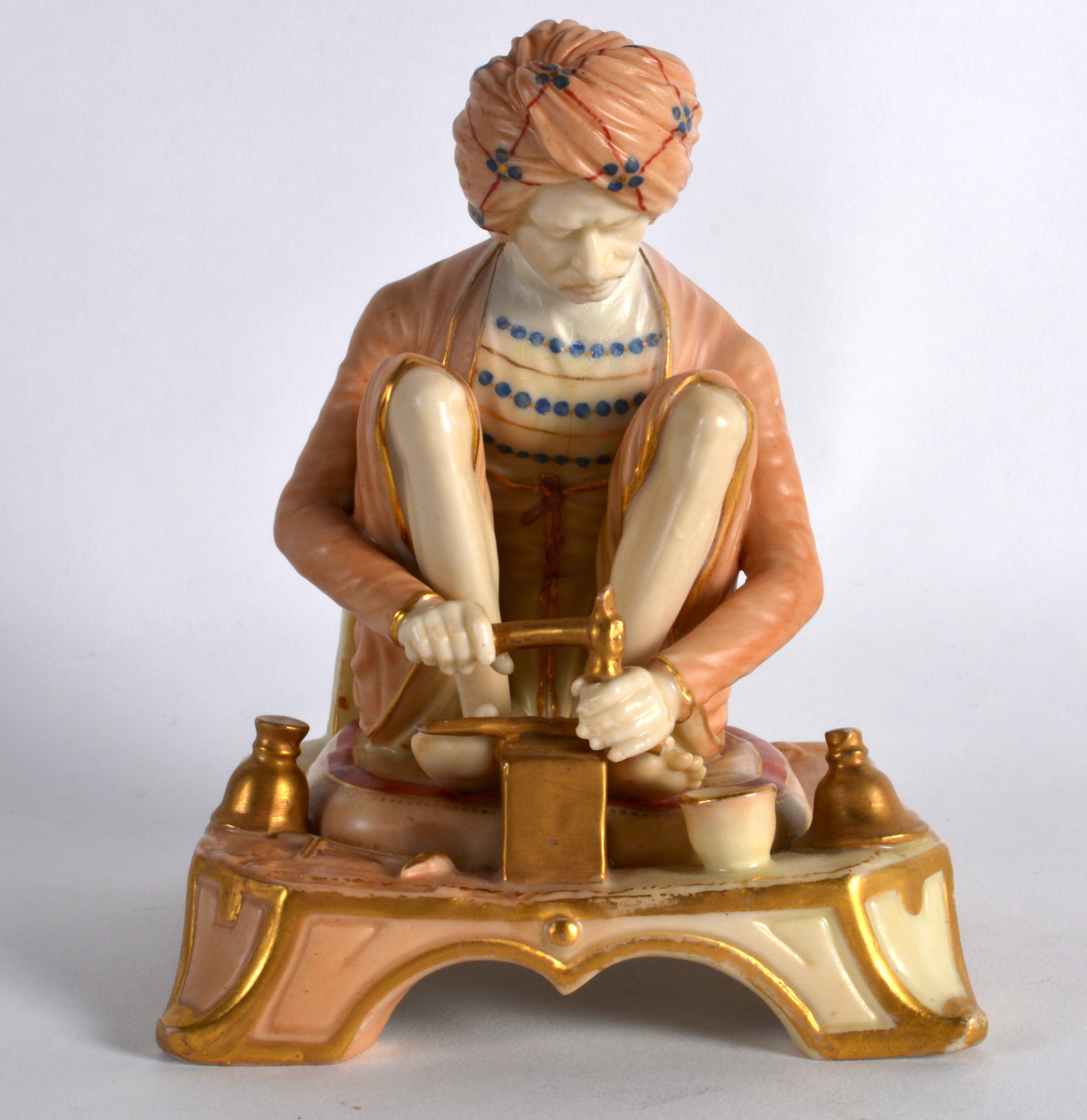 A RARE ROYAL WORCESTER FIGURE OF AN INDIAN CRAFTSMAN C1907 shape 1204. 5.25ins high.