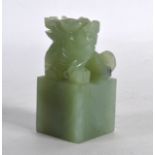 AN EARLY 20TH CENTURY CHINESE CARVED GREEN JADE SEAL in the form of a beast. 2.5ins high.