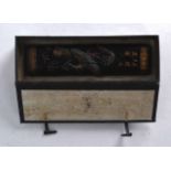 A CHINESE CARVED BLACK INK BLOCK decorated with dragons. Signed. 10Ins wide.