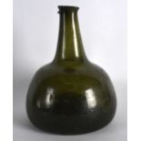 AN 18TH CENTURY GREEN ONION SHAPED BOTTLE with tapering neck. 7.25ins high.