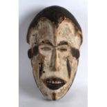 AN EARLY 20TH CENTURY AFRICAN CARVED WOOD POLYCHROMED MASK. 11.5ins long.