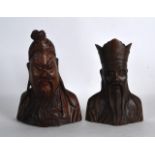 A PAIR OF EARLY 20TH CENTURY CHINESE CARVED HARDWOOD BUSTS OF BEARDED IMMORTALS. 7.25ins high.