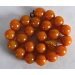A GOOD EARLY 20TH CENTURY BUTTERSCOTCH AMBER NECKLACE of spherical form. 79 grams. 1Ft 4ins long.