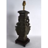 AN EARLY 20TH CENTURY CHINESE ARCHAIC STYLE BRONZE VASE converted to a lamp, with mask head