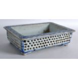 A 19TH CENTURY JAPANESE MEIJI PERIOD BLUE AND WHITE PLANTER of rectangular form, painted with