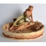 AN EARLY 20TH CENTURY AUSTRIAN PAINTED POTTERY FIGURAL CENTREPIECE modelled as a classical female