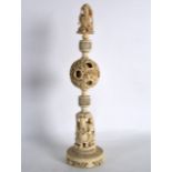 A GOOD 19TH CENTURY CHINESE CARVED IVORY PUZZLE BALL ON STAND the central ball decorated with