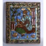 A PERSIAN PAINTED POTTERY TILE depicting a single seated male holding prayer beads within an