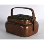 A 19TH CENTURY CHINESE COPPER HAND WARMER AND COVER with openwork foliate top. 5.5ins wide.