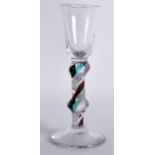 A 19TH CENTURY MULTI COLOURED SPIRAL TWIST GLASS upon a circular foot. 5.75ins high.