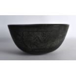 A 19TH CENTURY CHINESE BRONZE BOWL bearing Xuande marks to base, decorated with dragons amongst