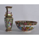 A 19TH CENTURY CHINESE CANTON FAMILLE ROSE BOWL together with a similar twin handled Canton vase.