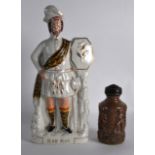 A LARGE 19TH CENTURY STAFFORDSHIRE FIGURE OF ROB ROY together with a Stoneware canister and cover,