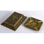 AN UNUSUAL RUSSIAN BRASS DESK BLOTTER together with a matching ash tray. (2)