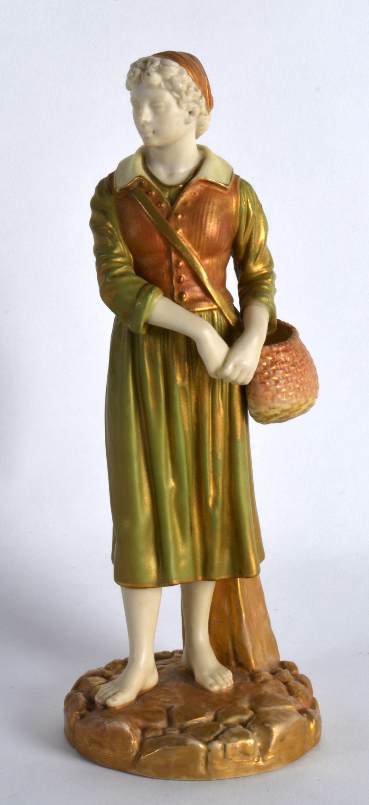 A ROYAL WORCESTER FIGURE OF THE FRENCH FISHERGIRL C1916. 8Ins high.