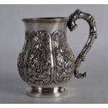 A 19TH CENTURY CHINESE EXPORT SILVER MUG by Wang Hing, decorated with panels of bamboo and birds.