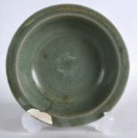 A CHINESE YUAN/MING DYNASTY CELADON DISH decorated in relief with two stylised fish. 4.75ins