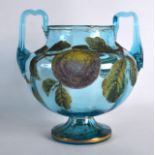 AN UNUSUAL TWIN HANDLED BOHEMIAN BLUE GLASS VASE decorated with jewelled fruiting vines, with gilt