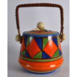 AN ART DECO CLARICE CLIFF BIZARRE BISCUIT BARREL AND COVER painted with lozenge shaped motifs. 7.