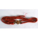 A YELLOW GOLD MOUNTED RED CORAL NECKLACE. 70 grams. 1Ft 3.5ins long.