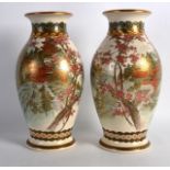 A PAIR OF EARLY 20TH CENTURY JAPANESE MEIJI PERIOD SATSUMA VASES painted with landscapes. Signed.