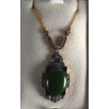 AN ART DECO STYLE GOLD DIAMOND AND SILVER JADEITE NECKLACE.