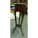 A WOODEN JARDINIERE STAND, WITH FOX HEAD FITTINGS. 2 ft 10ins high.