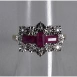 A 9CT GOLD RUBY AND DIAMOND RING.