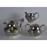 A LOVELY 19TH CENTURY JAPANESE MEIJI PERIOD FOUR PIECE SILVER TEASET decorated in relief with
