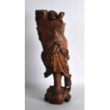 A 19TH CENTURY CHINESE CARVED HARDWOOD FIGURE OF A BUDDHISTIC MALE modelled holding a staff. 1Ft 5.