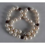 A DIAMOND ENAMEL AND PEARL NECKLACE.