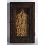 AN UNUSUAL EARLY INDIAN CARVED TERRACOTTA RELIC contained within a wooden case, the front